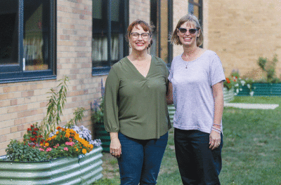  Carlson Elementary third grade teacher Jennifer Jones, left, and instructional coach Heather Graef received a $2,500 State Farm Teacher Assist grant to purchase supplies for the new butterfly garden.  