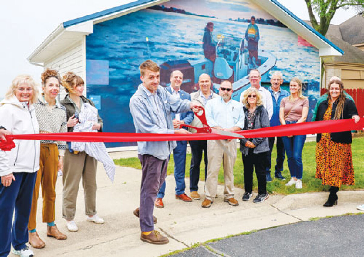  Harrison Township officials, the muralist and members of the Detroit Institute of Arts staff gathered to unveil the mural at the newly renamed Don and Candice Miller Park. 