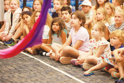  Children enjoy the Rainbow Circus program at the Shelby Township Library June 25. Each Wednesday the library offers a different program as part of its summer reading challenge. 