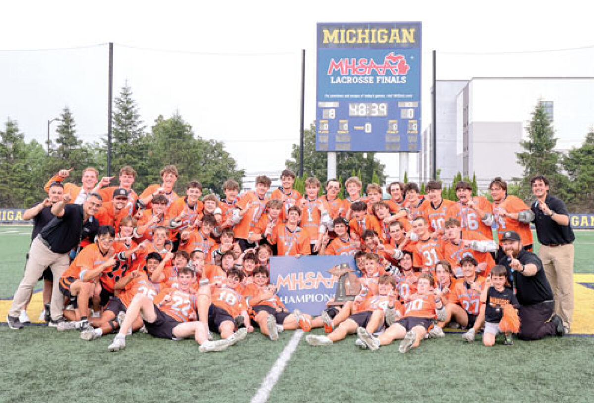  Brother Rice celebrates the program’s 17th Division I boys lacrosse state title at U of M Lacrosse Stadium after a 9-8 overtime victory June 6. 