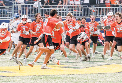  Ben Waechter runs to his team after scoring the game-winning goal in overtime. 