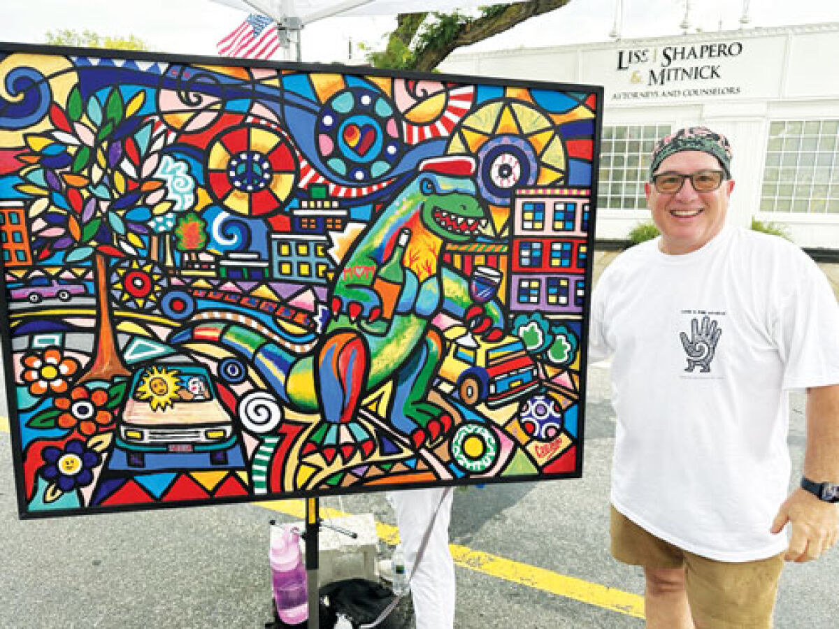  Attendees at the Berkley Street Art Fest helped create a mural with artist Daniel Cascardo. 
