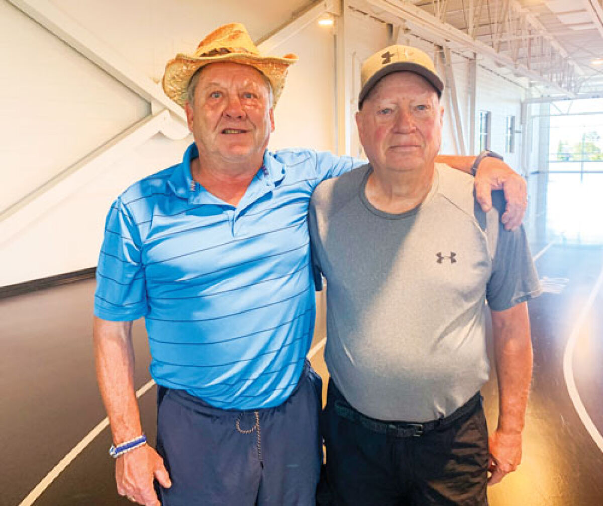  Art Siebert, left, and Jerry Boekhout, reconnected after about 60 years while walking together at the Sterling Heights Community Center. 