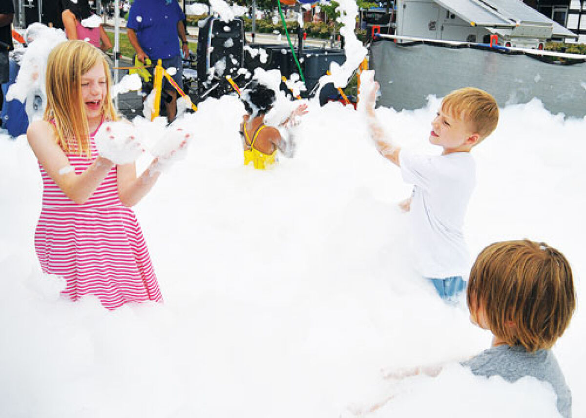  Kids enjoy the bubbles at the Farmington Founders Festival July 17-19. 