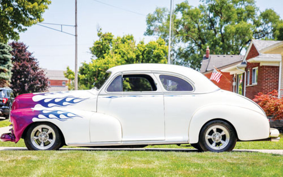  David Watson, of St. Clair Shores, had the purple and blue flames added to his white 1948 Chevrolet Fleetmaster Coupe.  