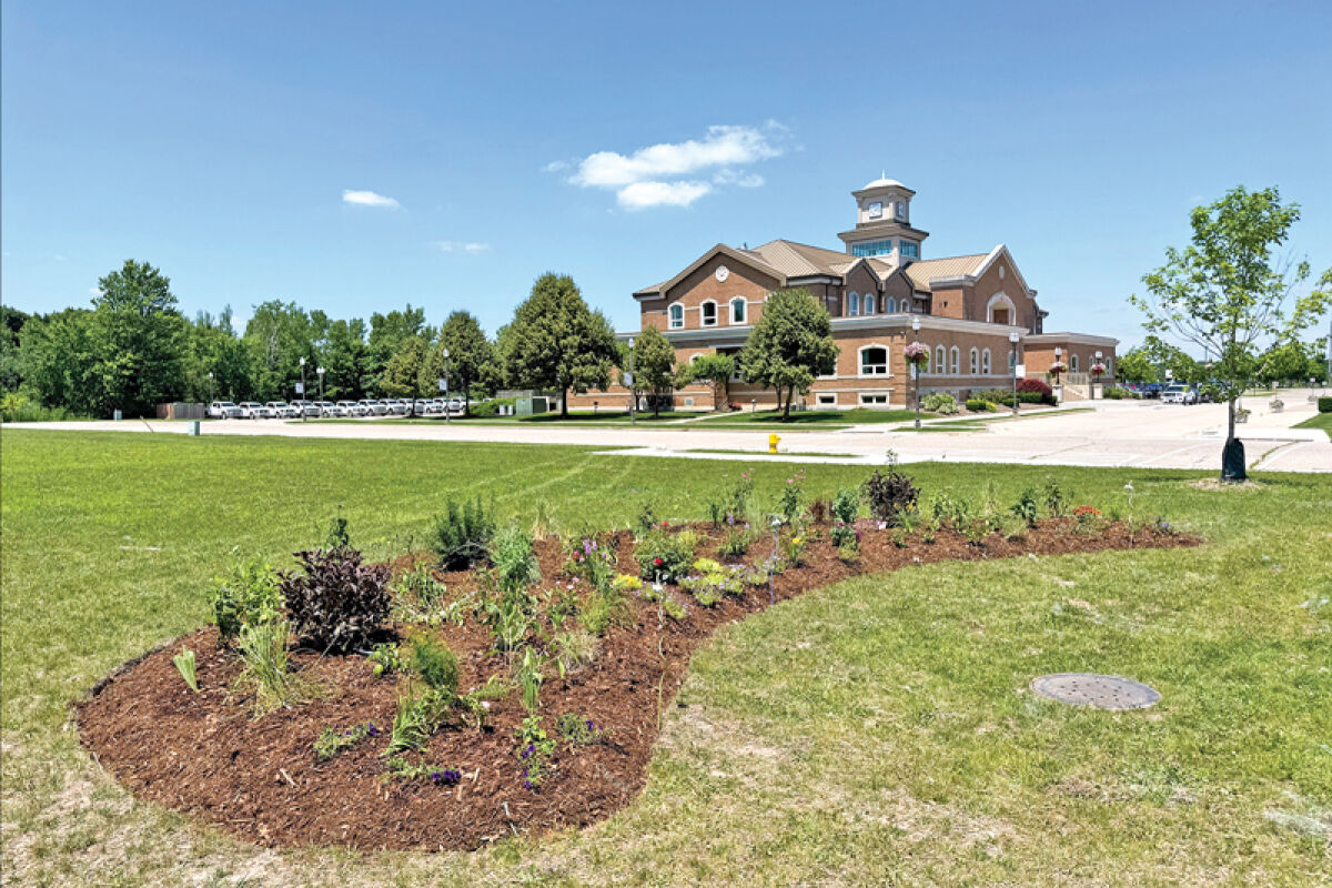  Volunteers planted a kidney-shaped pollinator garden next to Macomb Township Old Township Hall on June 27. It is part of a larger heritage garden to surround the old hall. 
