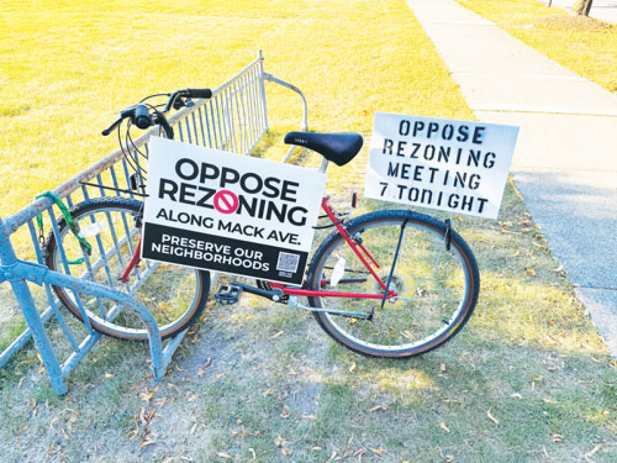 Signs opposing Mack Avenue rezoning in Grosse Pointe Woods were placed in front of Woods City Hall in advance of a July 22 Planning Commission meeting that attracted many residents. 