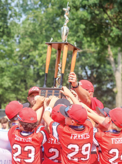  Greater Bay Little League hoists the tournament trophy after a win over Grosse Pointe Farms-City Little League on Thursday, July 31. With the win, Greater Bay Little League will advance to the Regional Tournament.  