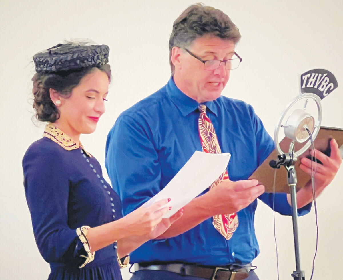  Actors Michelle Cohl and Tom Pagano perform during the Troy Historic Village’s Old-Time Radio Show last year, which was themed around superheroes. This year’s tale will have a science fiction theme. 