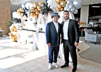  Fifth Avenue Furniture owners Ray Zerki, left, and Donovan Zerki stand inside their new showroom on Greenfield Road in Southfield. 