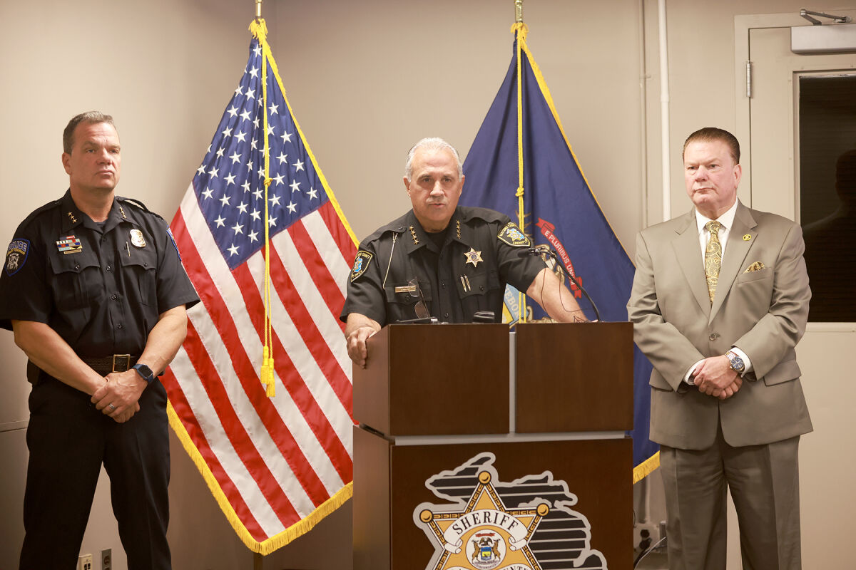  Macomb County Sheriff Anthony M. Wickersham  speaks to the media during a press conference Aug. 7 at the Sheriff's Office in Mount Clemens. Beside Wickersham at left is Shelby Township Deputy Police Chief Jason Schmittler and at right is Macomb County Prosecutor Peter Lucido.  