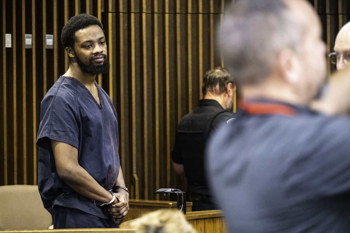  Deandre Booker stands in the jury box of 39th District Court Judge Joseph Boedeker’s courtroom at the start of an exam hearing Wednesday, Aug. 6. 