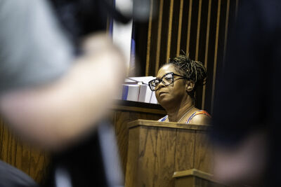  Monika Elkins, Ashley Elkins' mother, is seated on the witness stand while testifying during Deandre Booker's exam hearing Aug. 6. 