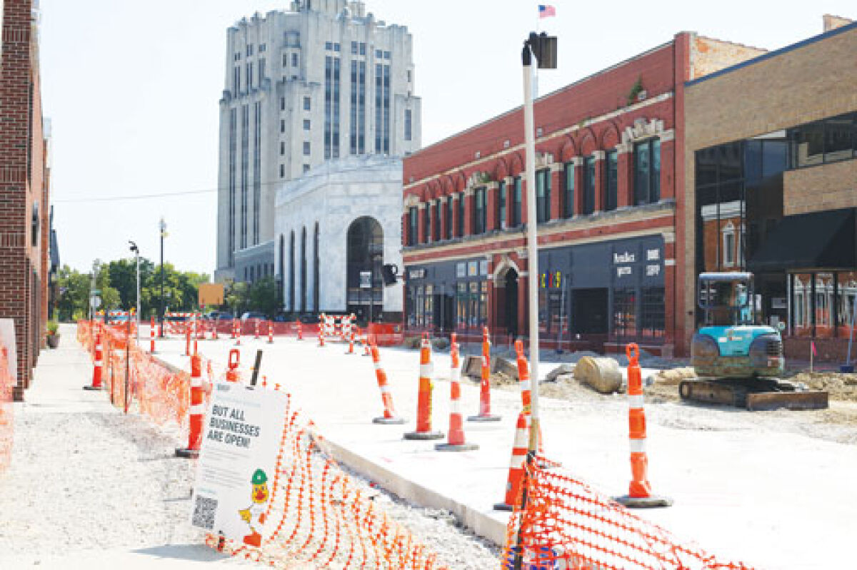  While the new surface of Macomb Place is paved, much work remains to be done in the Downtown Revitalization Project. 