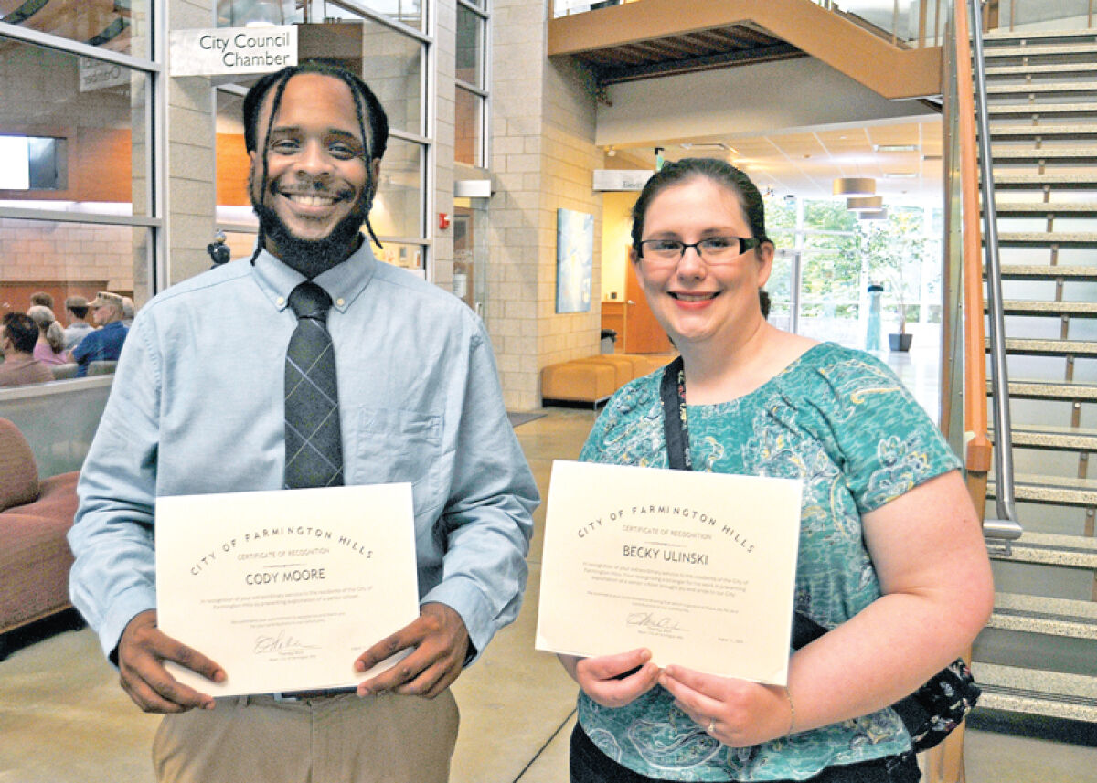  Cody Moore and Rebecca Ulinski were recognized by Farmington Hills City Council Aug. 11 after Moore protected a senior from a scam and Ulinski posted the moment to social media. 