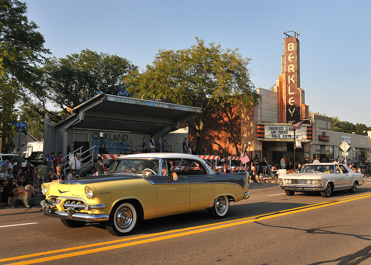  Classic cars drive by the Berkley marquee on 12 Mile Road during the annual CruiseFest Classic Car Parade. 
