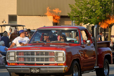 Flames burst from the exhaust stacks on this classic Dodge pickup truck. 