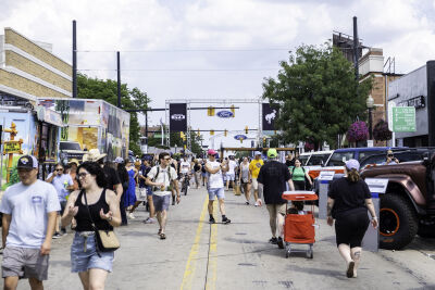  People walk past a line of Ford Broncos on display during the Woodward Dream Cruise Saturday, Aug. 16, 2025, in Ferndale. 