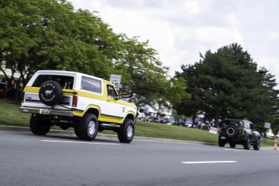  A classic Ford Bronco follows a newer model down Woodward Avenue during the Woodward Dream Cruise Saturday, Aug. 16, in Ferndale. 