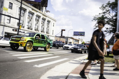  Spectators fill the medians on Woodward Avenue to watch cars cruise past during the Woodward Dream Cruise in Ferndale. 
