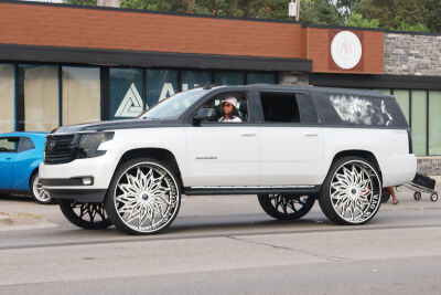 A customized Chevy Suburban cruises down Woodward Avenue Aug. 16.
