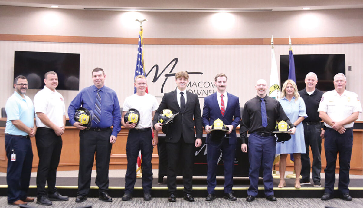  Macomb Township elected officials and Macomb Township Fire Department leadership pose for a photo with five new part-time firefighters at a swearing-in ceremony on Aug. 14. 
