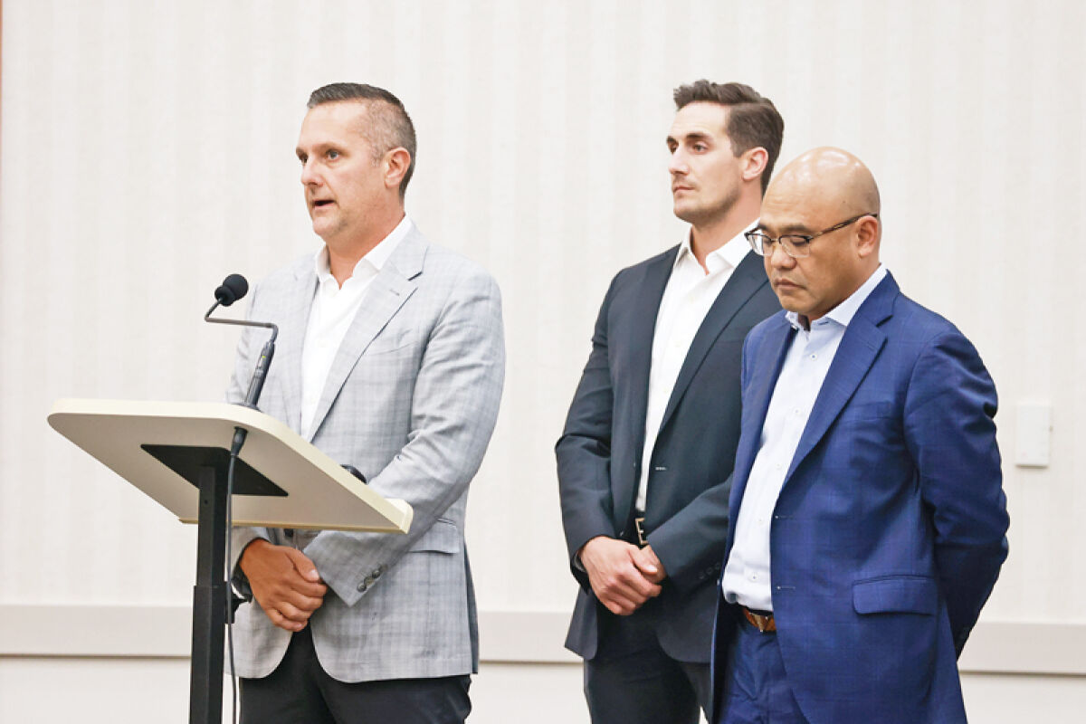  Priority Waste CEO Todd Stamper, left, speaks to the Macomb Township Board of Trustees about the waste hauler’s performance on Aug. 13. Priority Waste was issued a notice of default by the board in July for performance issues and given a public hearing at the Aug. 13 meeting to discuss how the company was addressing the issues. 