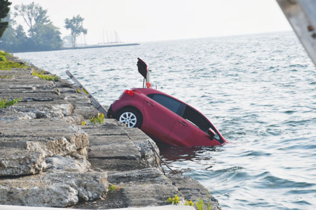  Grosse Pointe Farms Public Safety Department members rescued a woman from Lake  St. Clair Aug. 4 after she drove her vehicle into the water. 