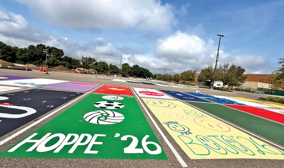 Freshly painted parking spots, designed and painted by Novi High School seniors, decorate a school parking lot Aug. 13. 