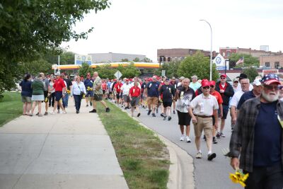  Members of the Old Crowd march down North River Road, nearing the end of the group’s annual parade through Mount Clemens at the YMCA on Aug. 21. Members will proceed by boat or other means to Lake St. Clair Metropark for a day of fishing, cooking and camaraderie. 