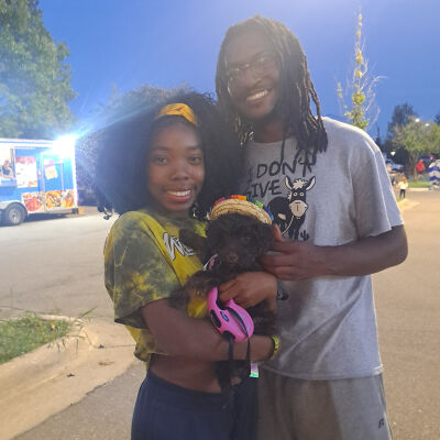  Jameelah Beckwith and Jeremiah Grant, of Eastpointe, are all smiles after their Aussiedoodle, Ruby, was declared the winner of the cutest dog contest at the Novi Taco Fest on Friday night, Aug. 22. 