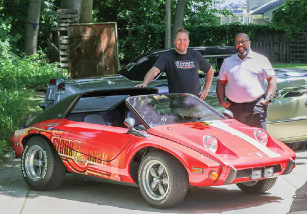  In this file photo from 2024, Madison Heights City Councilman Quinn Wright, right, meets with Murray Pfaff, of Pfaff Designs in Royal Oak, to plan the car show Revin’ in the Heights, which this year takes place at Civic Center Plaza Sept. 13. The ride seen here is a 1974 Meyers Manx SR2. 