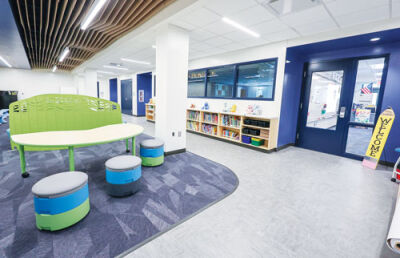  The kindergarten area at the newly remodeled DeKeyser Elementary in Utica Community Schools features a collaboration area as well as separate classrooms.  