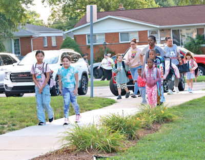  Forest Park Elementary students make their way to class on the first day of school. The school has a new principal this year, Randolph Hull. 