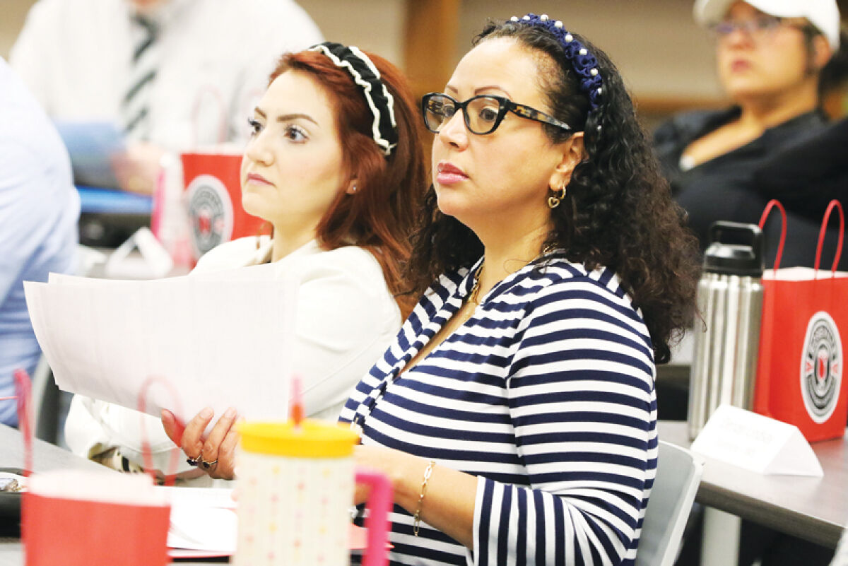  On Aug. 25, Roseville Community Schools held an orientation for new teachers and support staff. Attendees included Roseville High School French teacher Joelle Fares, left, and RHS Spanish teacher Francis Reyes Goitia, right. 