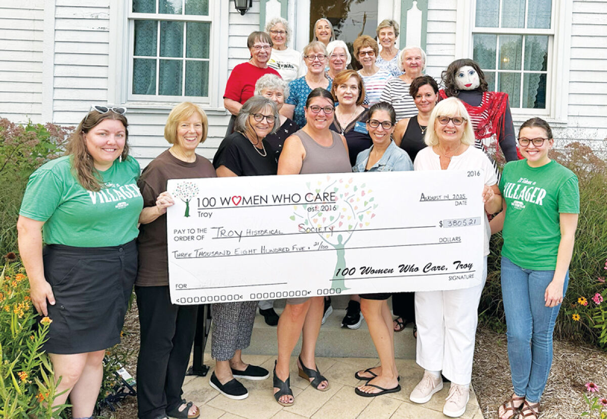  Representatives with Troy 100 Women Who Care presented the Troy Historic Village with a donation Aug. 14 for its Indigenous Voices program. 