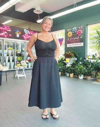  Nancy Kassab, owner of Flowers by Nancy K, poses for a picture inside her flower shop in Berkley.  