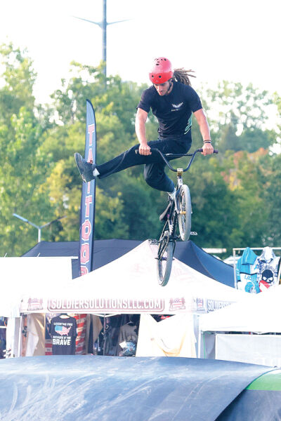  BMX rider Tyler Hill, of Dowagiac, performs a stunt during the Dialed Action show. 
