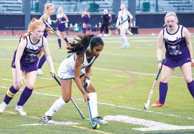  Novi High School’s girls go on the attack in a field hockey game against Plymouth-Canton Educational Park. 
