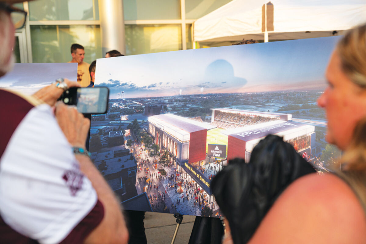  Fans check out renderings of AlumniFi Field. Construction is set to start at the end of 2025. 