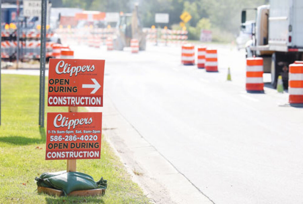   Signs point to Clippers Family Hair Care, a Clinton Township salon stuck in the middle of an extensive Macomb County Department of Roads construction site.  