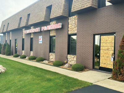  This photo of Selfridge Plating was taken on Sept. 10. A door is boarded up and danger notices hang on another door.  