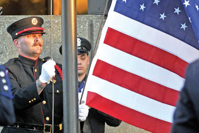  Members of the Roseville Honor Guard post the colors in front of the Macomb County Fallen Heroes Memorial. 