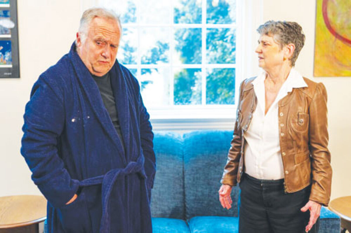  Phil Potter plays an essayist and Laura Bartell plays a magazine editor in Purdon Studio Theatre’s production of “The  Lifespan of a Fact.” 