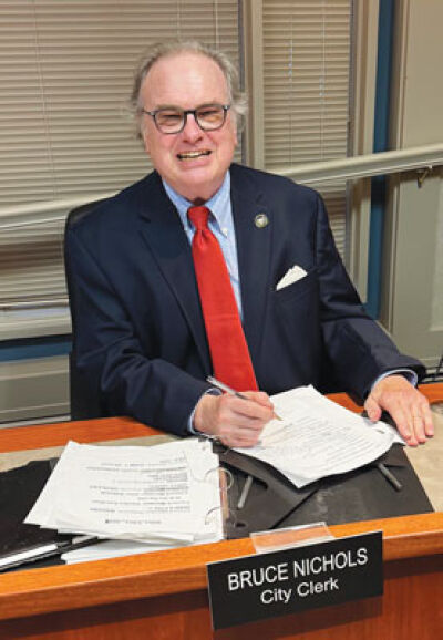  Grosse Pointe Shores City Clerk Bruce Nichols — who stepped down from the volunteer position  Aug. 31 — is seen here, before a July 15 Shores City Council meeting, at the desk he occupied for these meetings. 