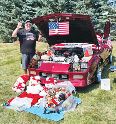  Roger Cremont, of Shelby Township, brought his 1991 Chevrolet Camaro Z28 to the Patrick L. Rinke Memorial Peach Festival Car  Show Aug. 31.  