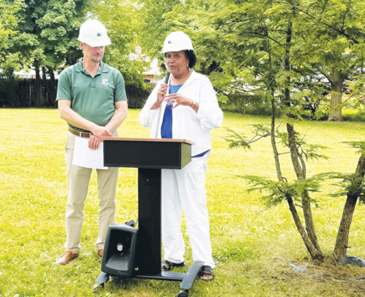  From left, Harper Woods City Manager John Szymanski and Mayor Valerie Kindle address attendees during the groundbreaking for Roscommon Pocket Park. 