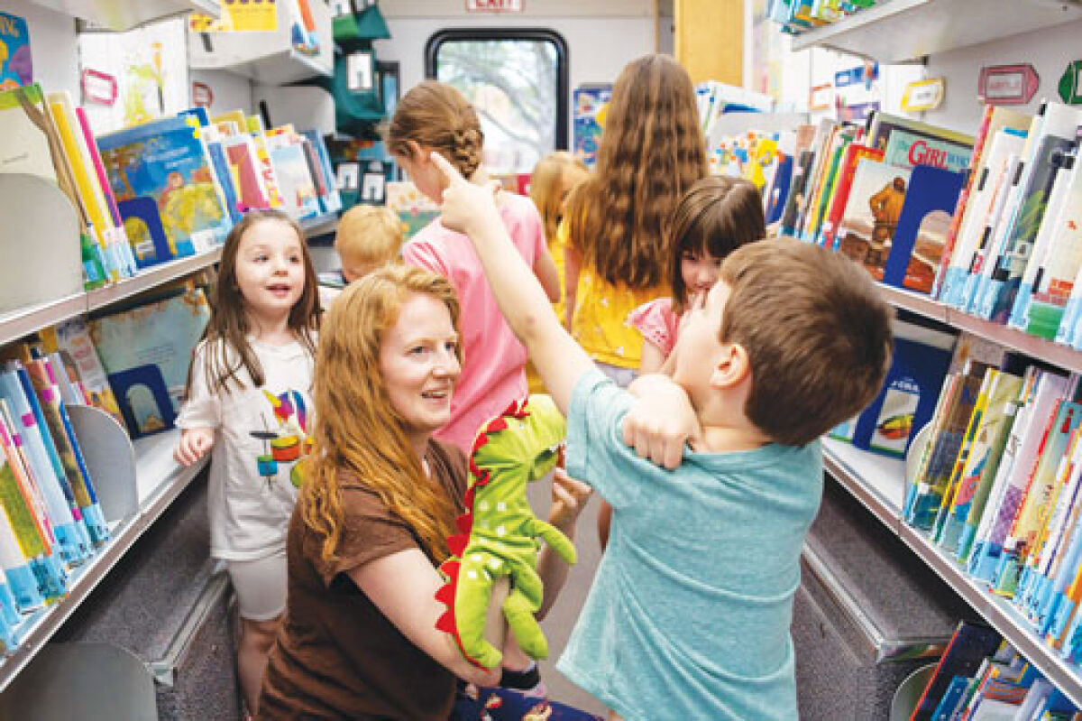  The library recently upgraded its existing fleet of bookmobiles, including a new early literacy one that hit the roads in June, thanks to the  increase in funding from its three member communities.  