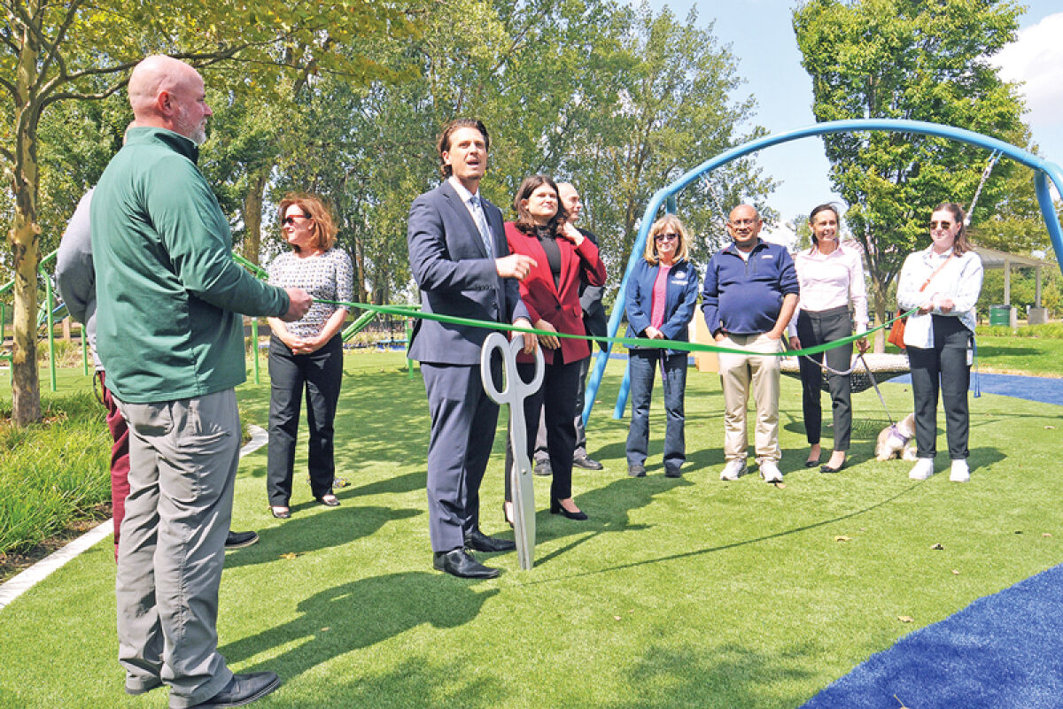  During a ribbon-cutting ceremony at Sylvan Glenn Lake Park Sept. 5, families and officials celebrated the addition of new grant-funded play structures and other amenities. 