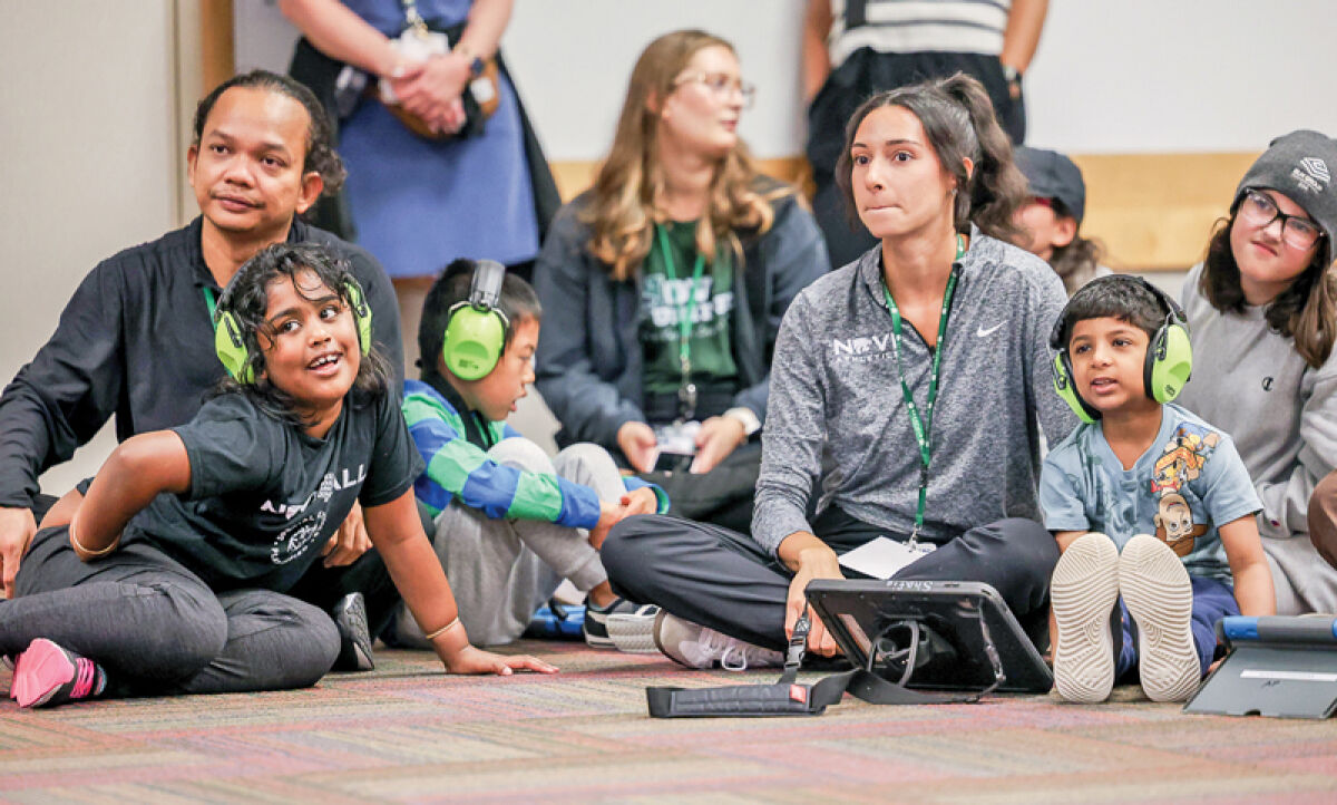  Children in the Novi Community School District Novi4ALL Program enjoy a special sensory-friendly performance by members of  Venardos Circus at the district’s Roar Center on Sept. 10. 